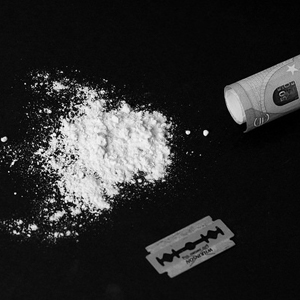 Stock photo of cocaine for You have cocaine in your wallet written by Anna Mouton. Photo by Marco Verch.
